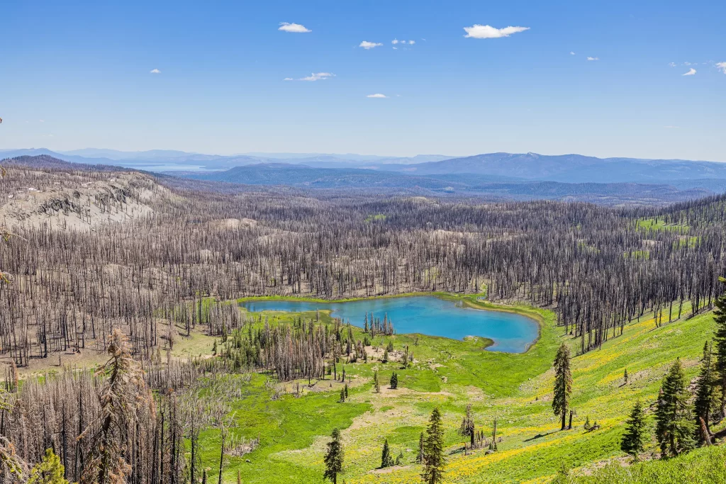 A high view of the turquoise Crumbaugh Lake at Lassen Volcanic National Park.