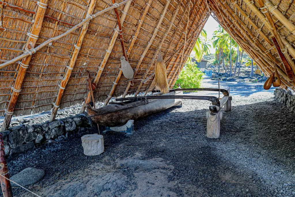 Thatched shelter with marine craft Puʻuhonua o Hōnaunau National Historical Park.