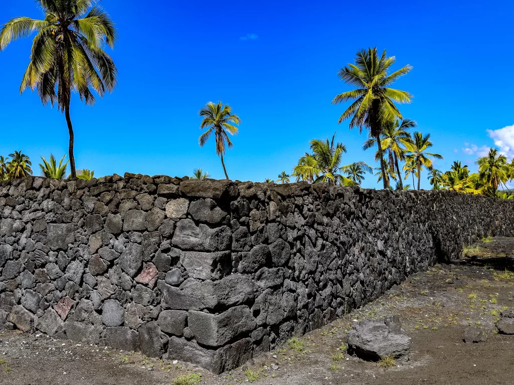 Black basalt rock wall at Puʻuhonua o Hōnaunau National Historical Park