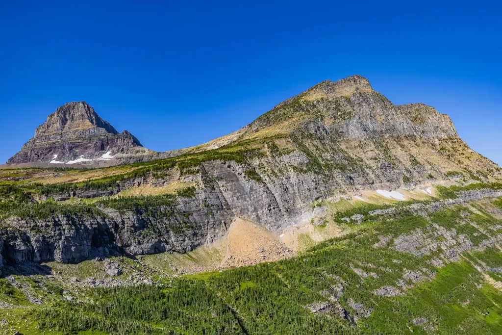 Snow is still visible late in the year, on the mountains of Glacier National Park.