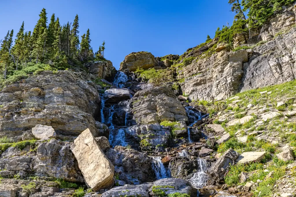 A very active waterfall tumbles down the granite.