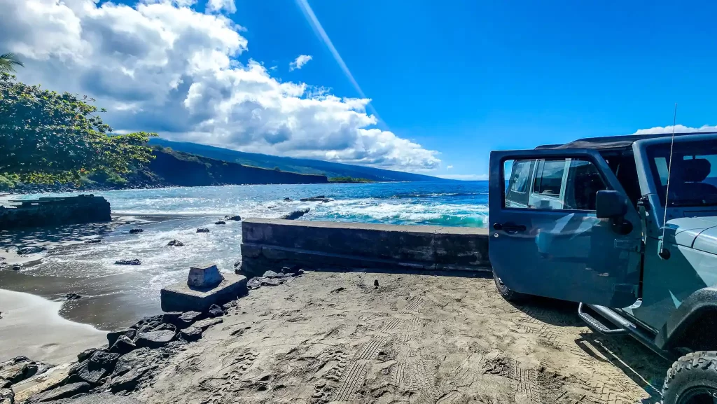 Jeep with open door at Ho'okena Beach Park, Hawai'i.