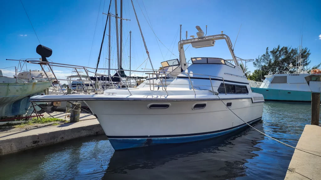 Carver yacht sitting in a concrete slip awaiting boat yard services.