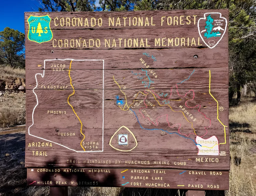 Large painted wooden sign for Coronado National Forest Memorial.