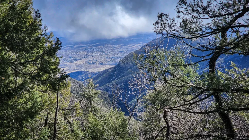 A cloudy valley view from the Arizona Trail through Coronado National Forest.