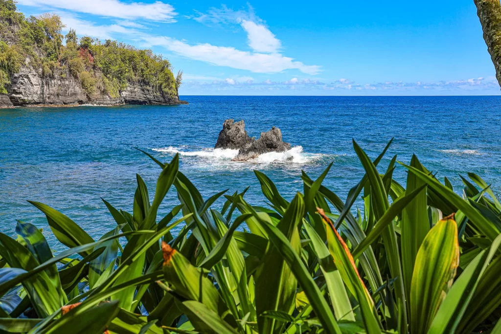 Two rugged rocks embrace in Onomea Bay.