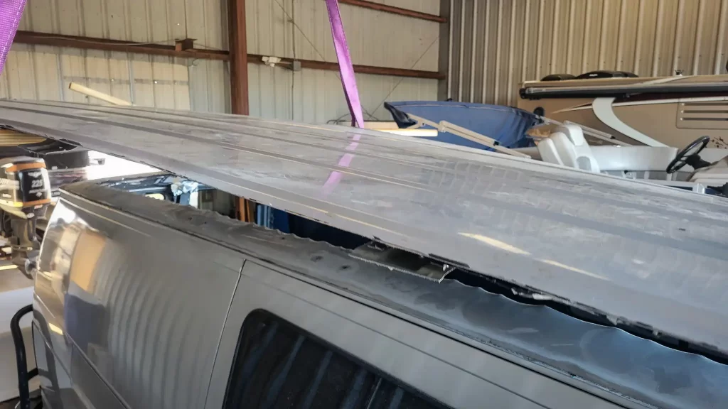 The metal roof of our van being removed, preparing for a high top installation.