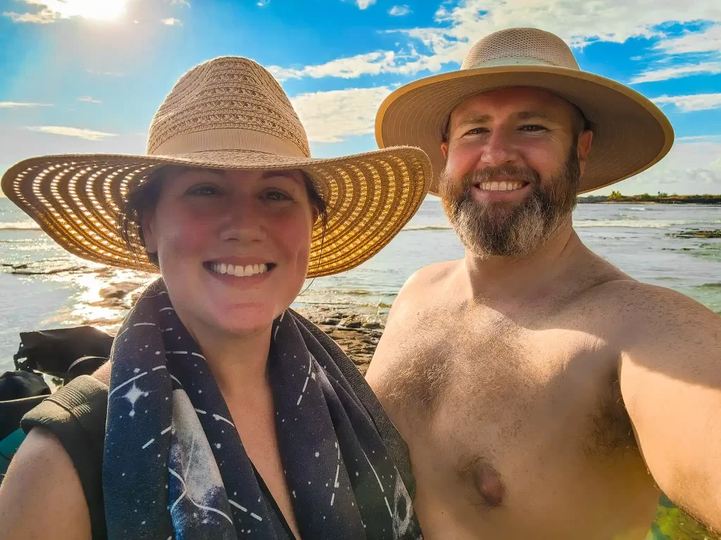 Tom and Elyse smiling on the beach.