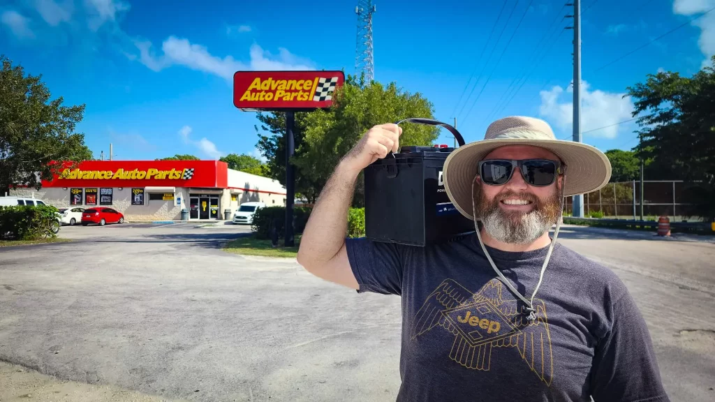 Tom carrying a heavy AGM battery from Advance Auto.