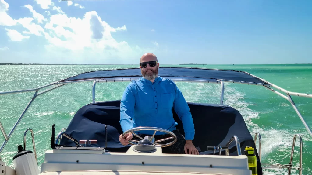 Tom at the helm of our 1989 Carver Santego.