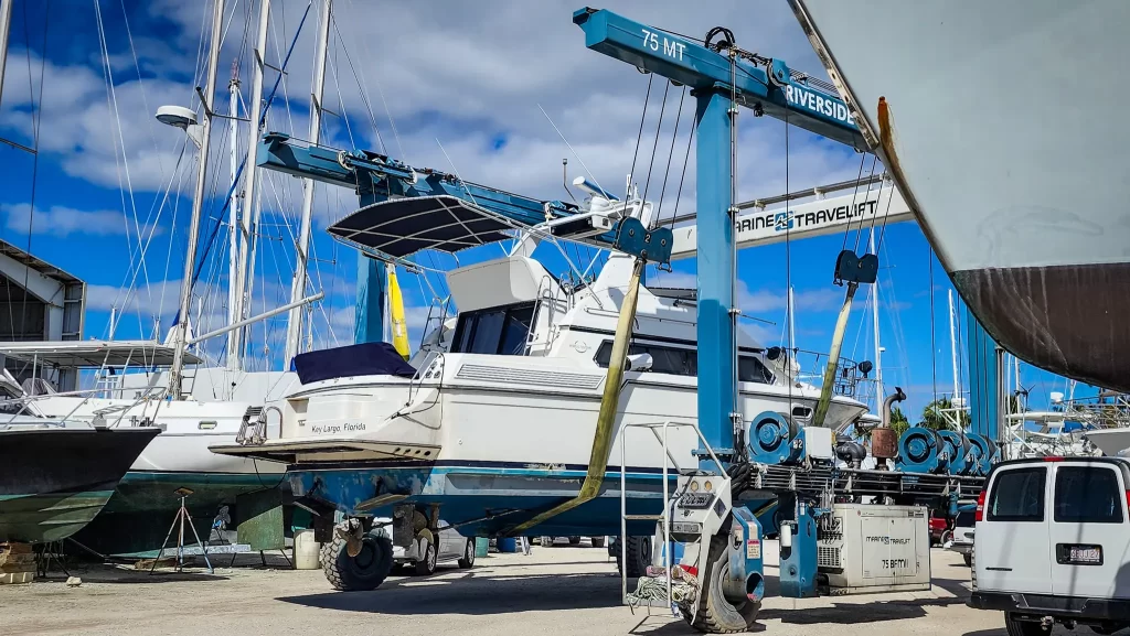 1989 Carver Santego 38 being moved in a massive Travelift.