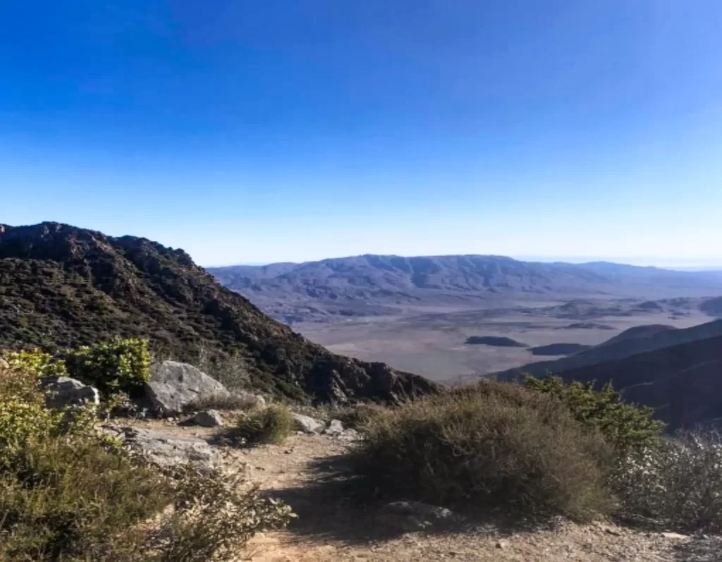 Distant mountain ranges beyond the mountains in the forefront.