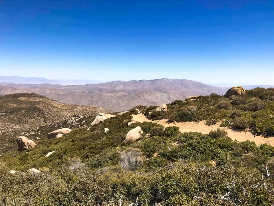 The Pacific Crest Trail winds through pale boulders.